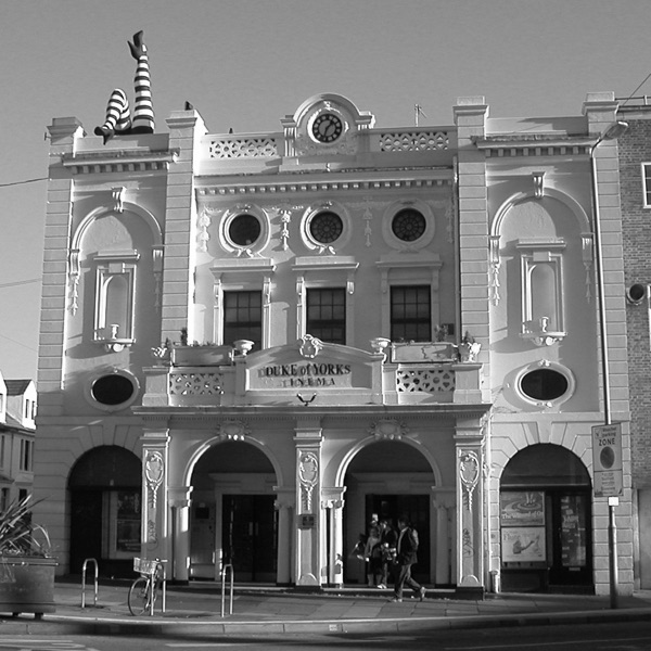 The distinctive exterior of the building features a giant pair of bestockinged legs.